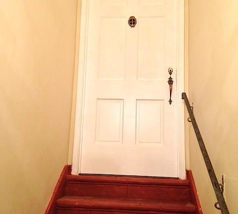 Entry door at top of the stairs