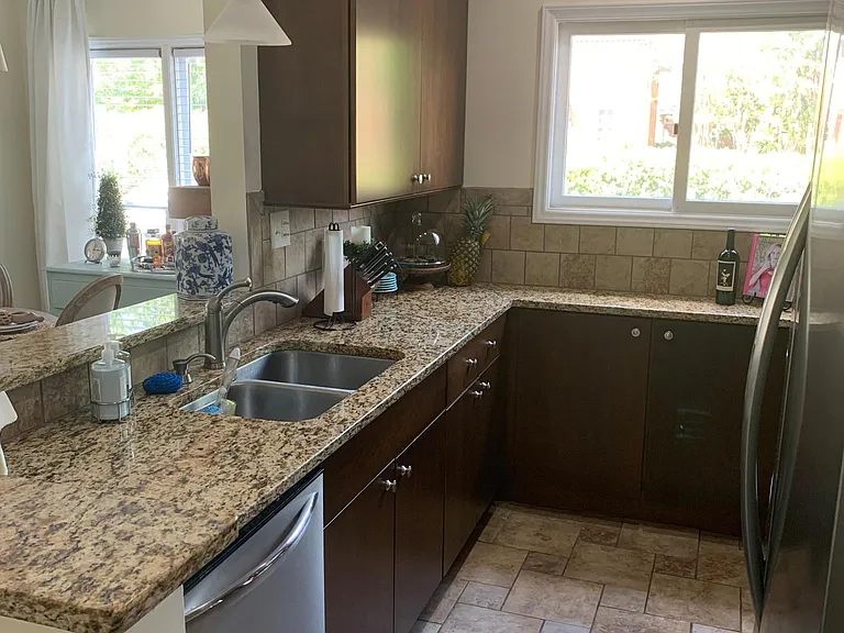 Open concept kitchen to dining and living area