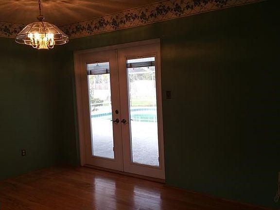 Formal Dining with French Doors leading to Pool Entertaining Area