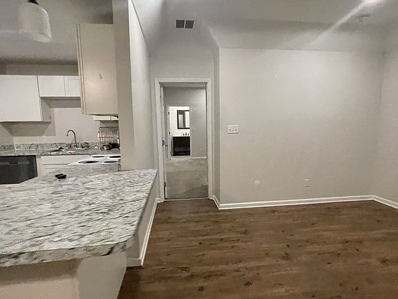 dining area to the right of the bar , outside of the master bedroom