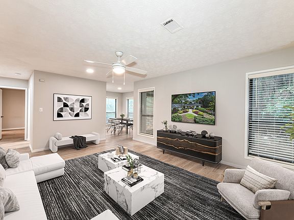 Spacious living room looking toward dining area