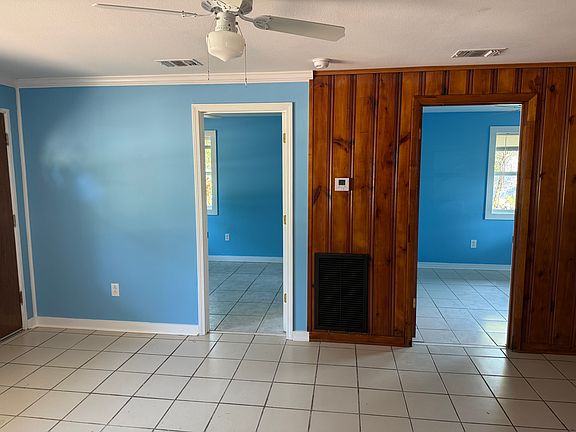 Front bedroom (L), and back bedroom (R) view from kitchen/dining area
