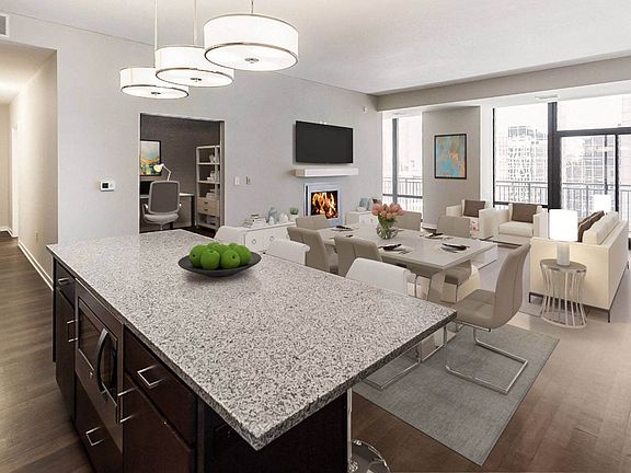 Nic on 5th Apartments in Minneapolis, Minnesota- large living room with wooden floors and views of Downtown West Minneapolis