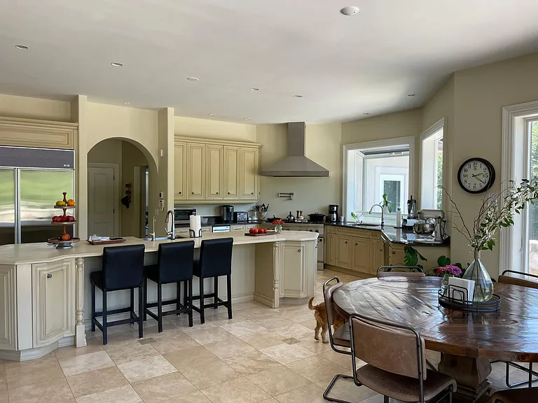 Dine-in kitchen with expansive island and island seating