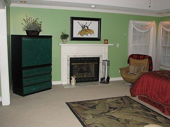 Master suite w/ fireplace has separate sitting area for office or exercise rm