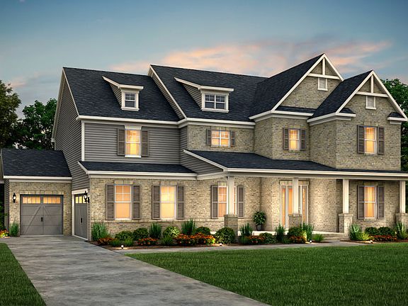 Fearington Exterior 23 features brick, hardie siding, covered front porch and 3 car sideload garage