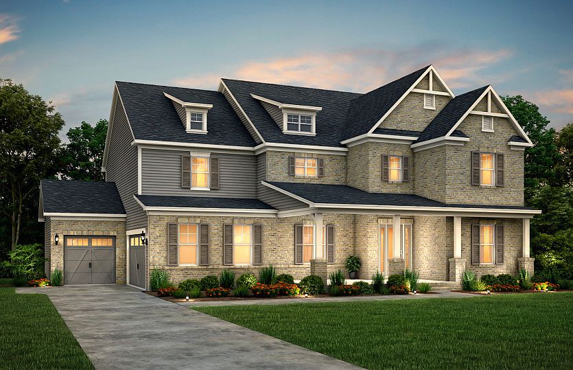 Fearington Exterior 23 features brick, hardie siding, covered front porch and 3 car sideload garage