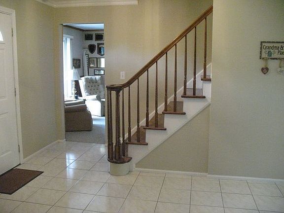 Foyer with ceramic tile flooring