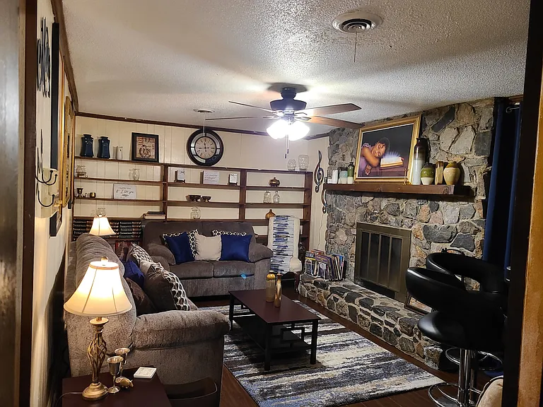 Spacious Den with fire place, bar area, Alexa Assistant for controlling smart home & 55 inch smart TV.
