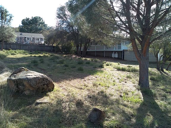 Boulder near NE corner of lot