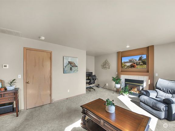 Family room with gas fireplace and direct access to garage>