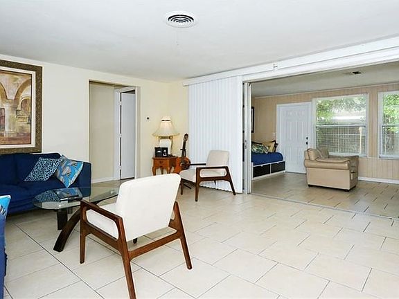 Neutral tile and wall paint throughout the main living area