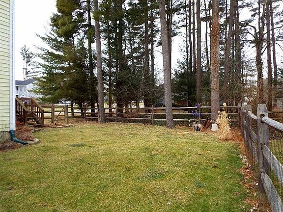 Nice fenced in backyard. There is also a small landscaping pond next to the deck.
