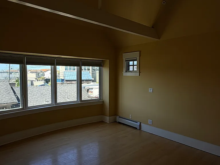 Second bedroom with vaulted ceilings, private bath and walk in closet