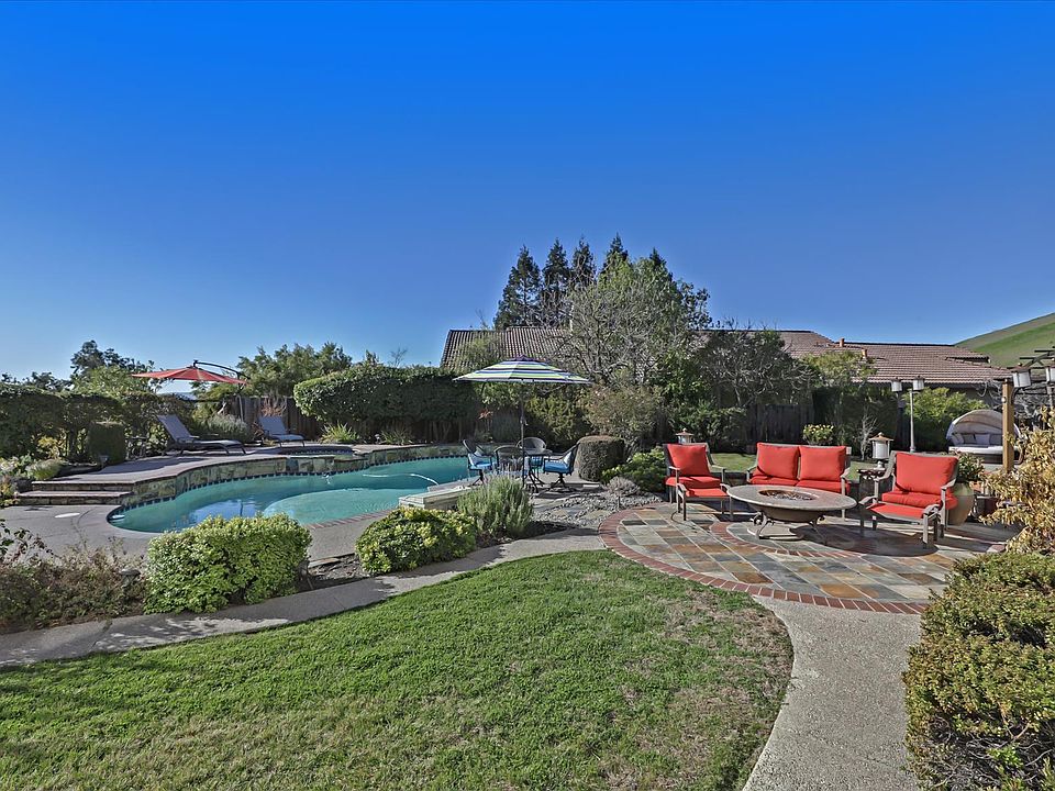 Expansive Backyard with views on Large Lot complete with POOL, SPA, Waterfall!