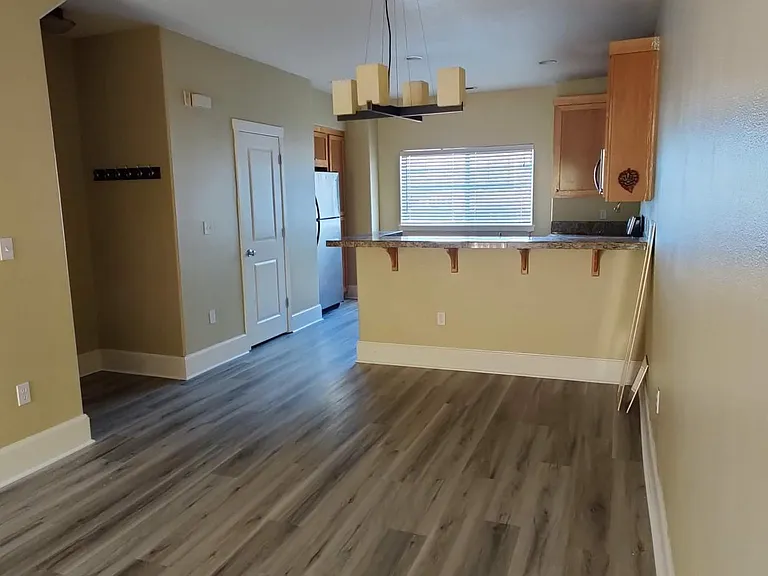 Entry, dining space, kitchen & a small bathroom
