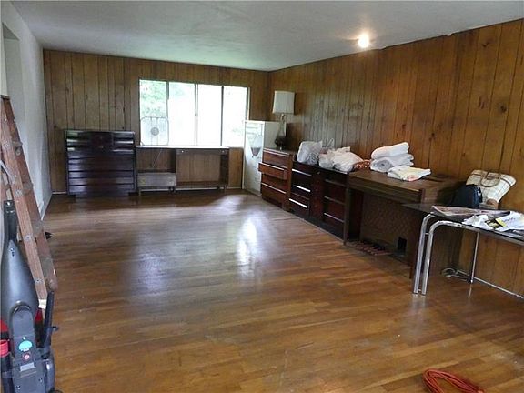 The combo living room dining room has hardwood floors and plenty of natural light.