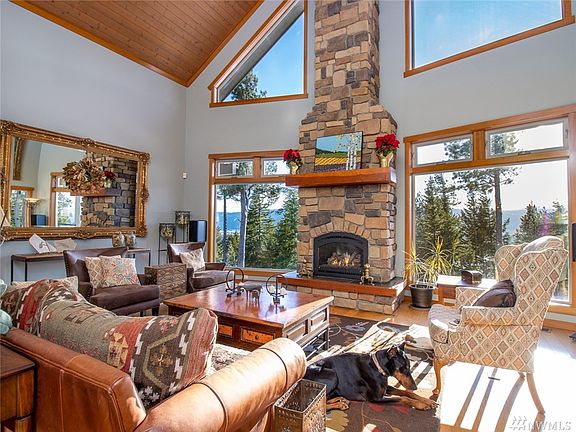 Slated entry, & gorgeous European wood flooring, with radiant heat throughout. Floor to ceilings stone fireplace features propane heat w/blower.