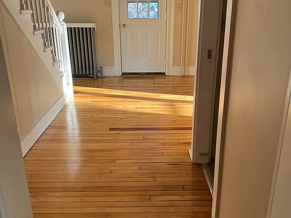 front hall with half bath off to the right