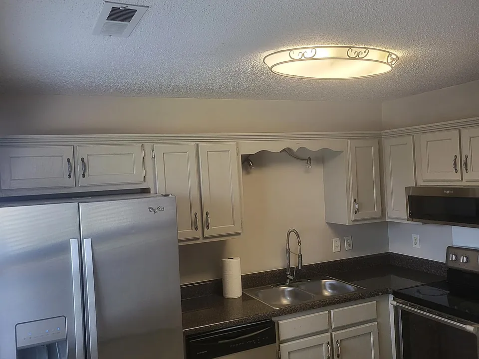 Stainless Appliances include Refrigerator with Ice and Water on door. Dishwasher, Smooth top Stove, built in Microwave.