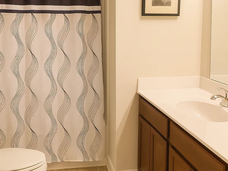 Upstairs full bathroom with a sleek vanity, bright lighting, and a clean shower/tub combo. Designed for both comfort and functionality.