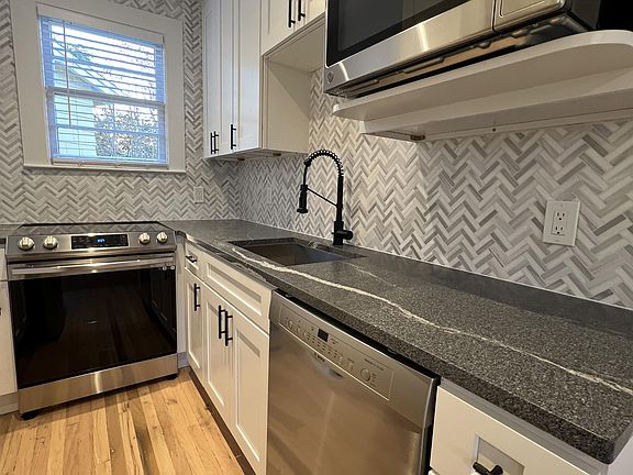 Kitchen also has all stainless steel appliance, including dishwasher, microwave & slide-in stove.