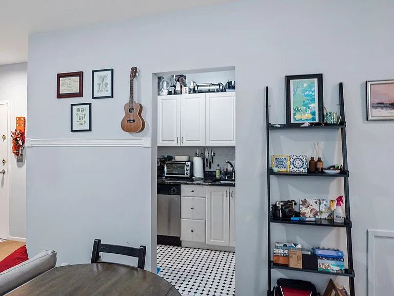 View of entrance and kitchen from dining area