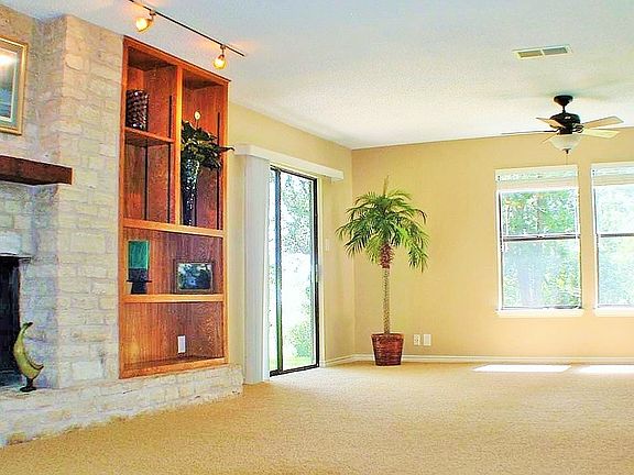 White stone wood burning fireplace! With built in adjustable