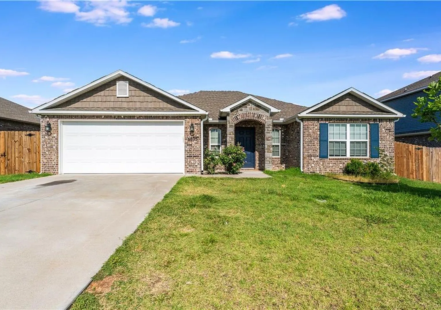 Home is very open, bright with 3 grand arch ways and plank wood flooring — Photo 2