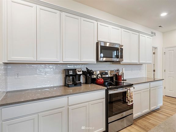 Additional view of the kitchen.