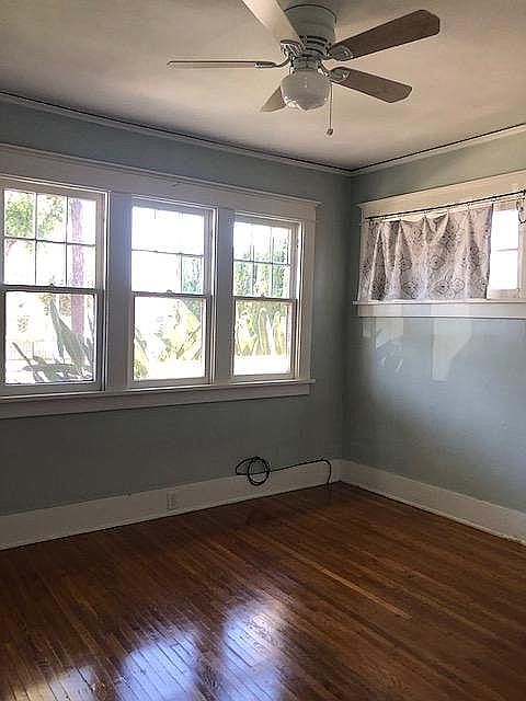 Naturally well lit, the front bedroom has access to the full bathroom. Measures 10-1/2' x 12'.