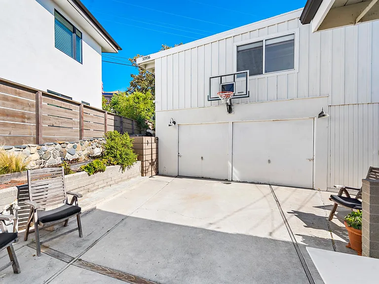 Garage used by owners for storage. Laundry in garage, shared by front home and back home. Basketball hoop can be used by tenant anytime. Not used by owners, unless back home not tenant occupied