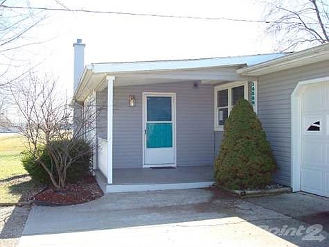 Large cement approach to the front porch.
