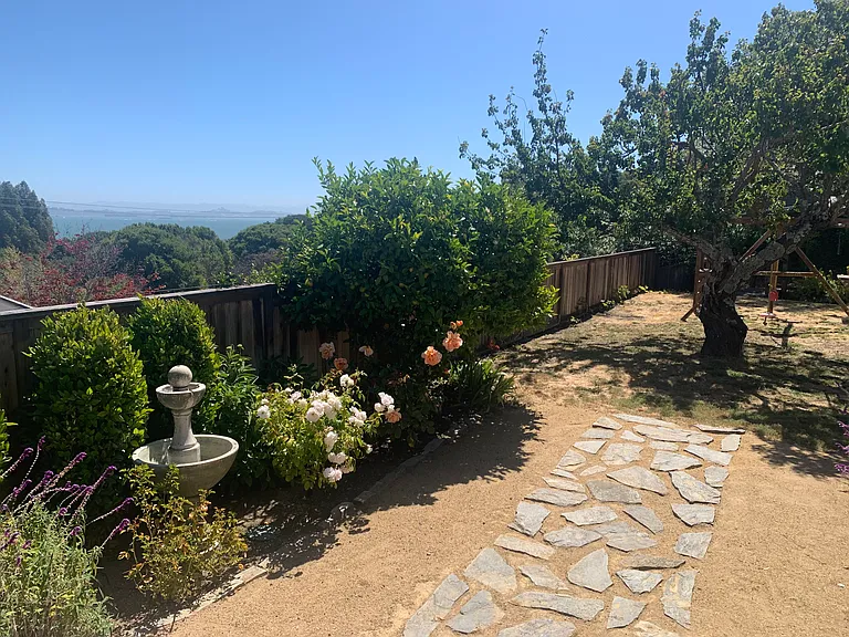 Backyard fountain and path to yard