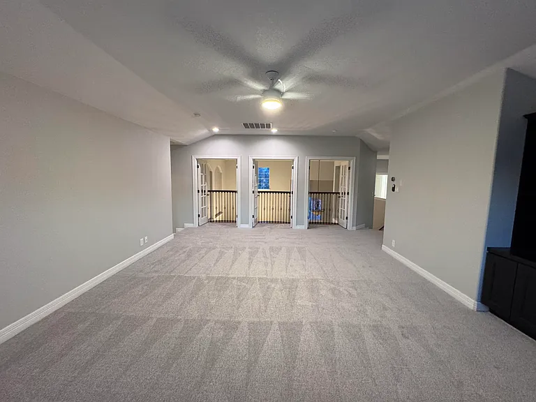 Large loft/game room with built in desk