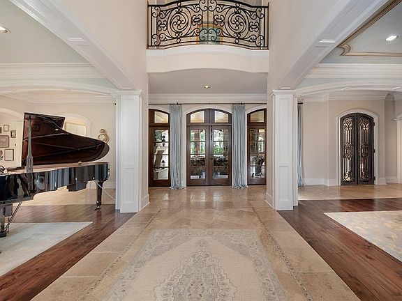Two-story foyer overlooks the large covered lanai.