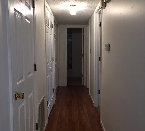Hall from LR to bathroom, BR, and utility room.