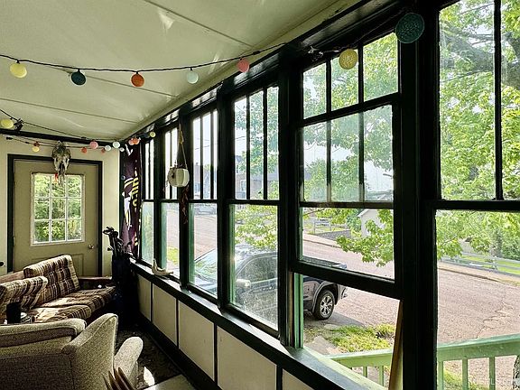 Sunroom/Mudroom where the bottom unit (1st floor) and the upper unit (2nd and 3rd floors) each has a separate entrance.