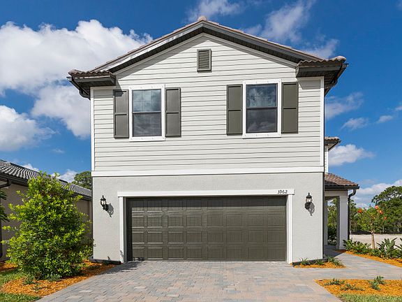 Driftwood exterior with shutters and tile roof