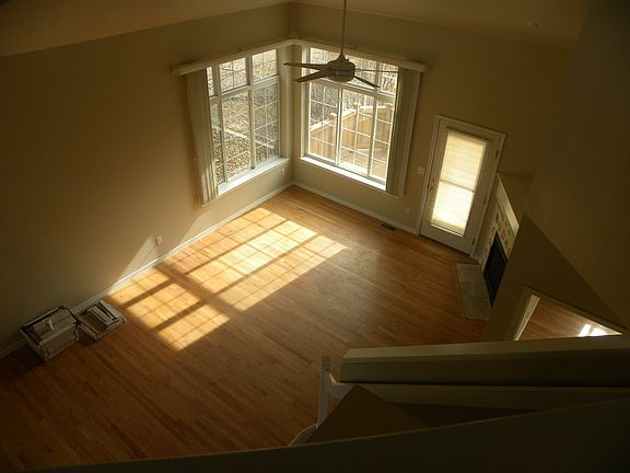 Dramatic two story Living room w/hardwood floors