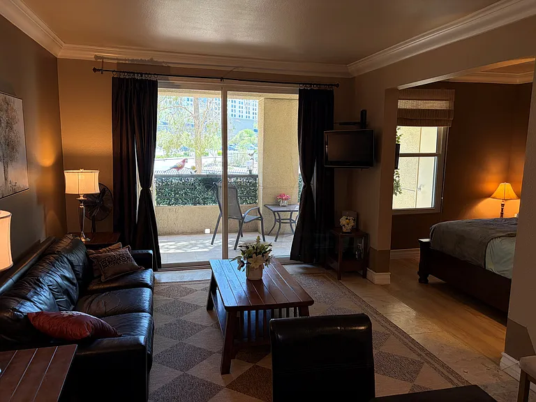 Spacious open-concept living area featuring a comfortable living room and sleeping area with a very comfortable king size bed to make extended stays feel like home!