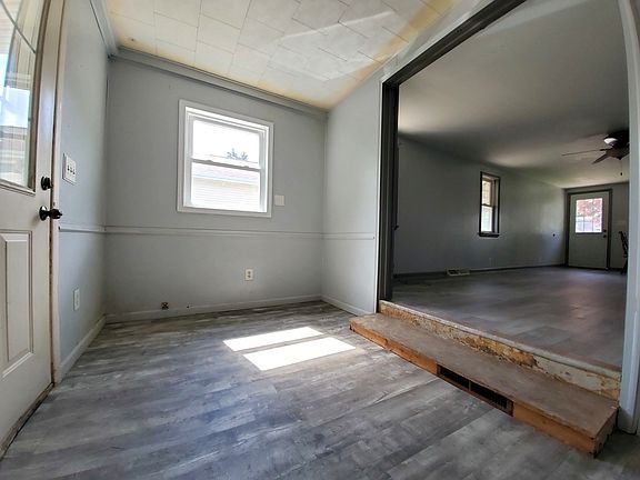 back entrance going to living room/ has barn door