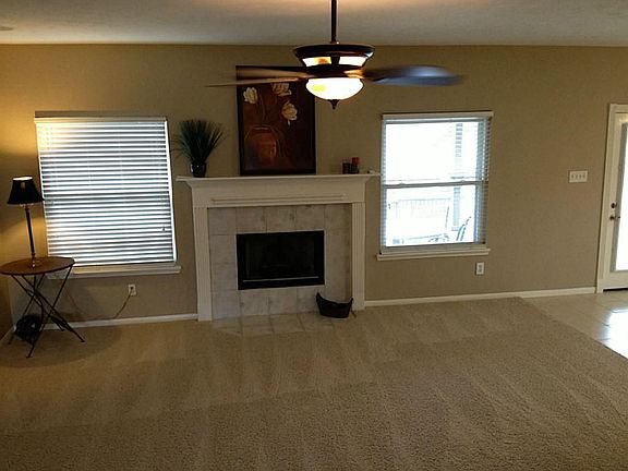 Large Living Room with Gas Log Fireplace, new carpet & paint.  Wired for surround sound.