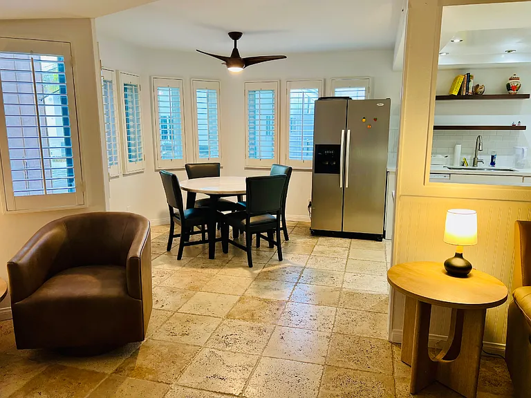Windows wrap around the lounge area and kitchen