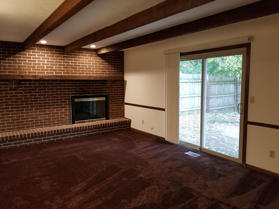 Family room in the back with a slider exiting to your fenced