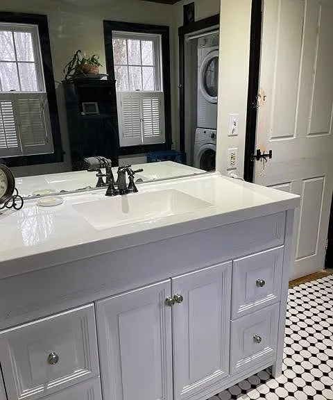 Downstairs bath with storage area not shown