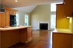 Open kitchen with wood burning fireplace