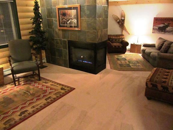 living room:  featuring 3-sided gas fireplace