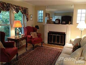 Living room with wood burning fireplace