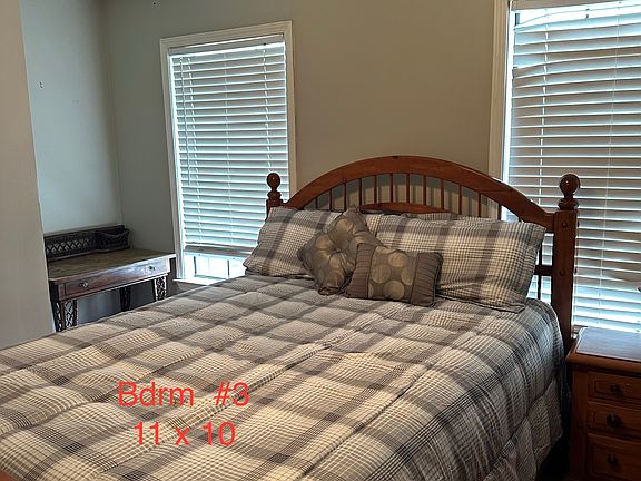 11x 10 Queen Size bedroom, with closet, chest of drawers and TV